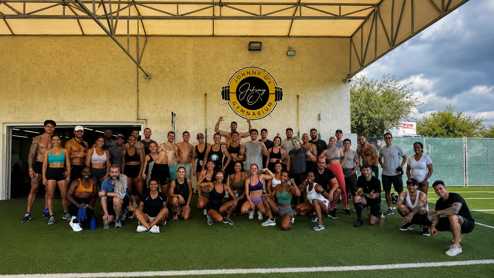 Members and coaches outside Johnny O’s Gymnasium